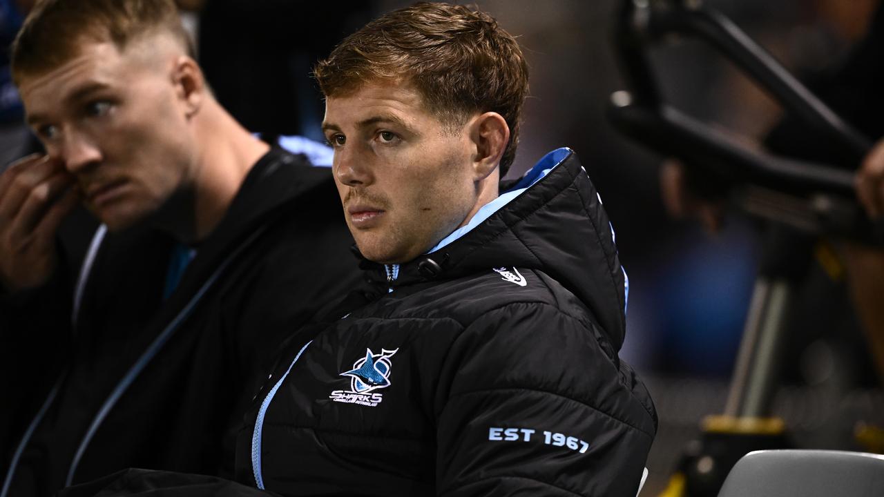 Blayke Brailey of the Sharks watches on from the bench