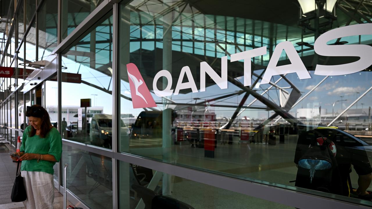 Signage is seen at the Qantas departures