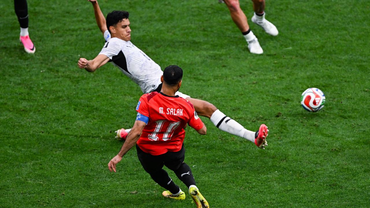 Marko Stamenic is unable to prevent Egypt's Mohamed Salah