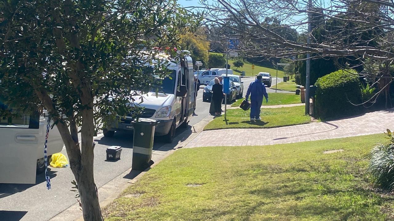 Police attend a house where a man was gunned down in Glen Alpine