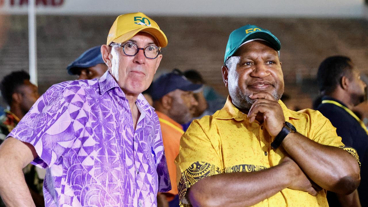 Ewen McDonald and James Marape (file image)