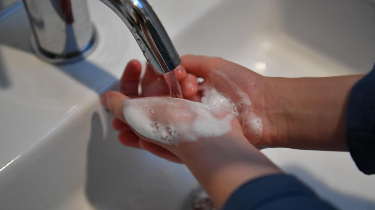 A child washes his hands