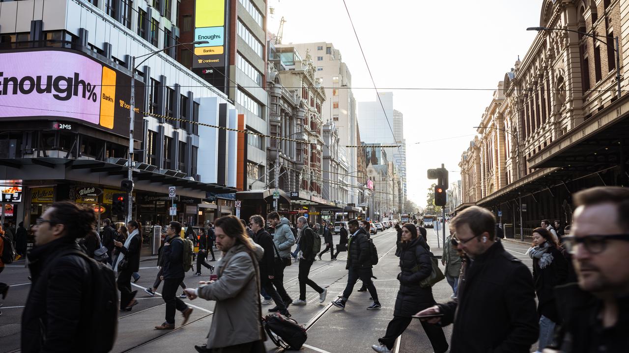 Morning commuters outside Flinders Street station