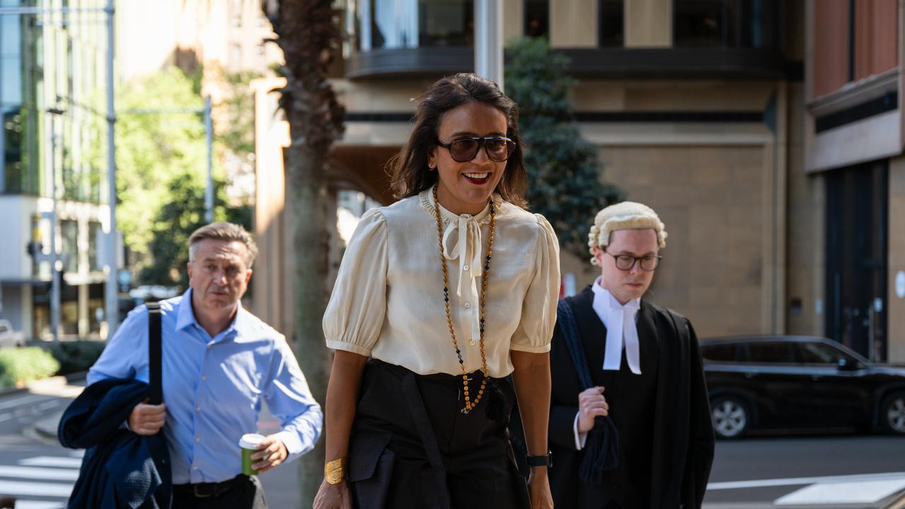 woman walks to court