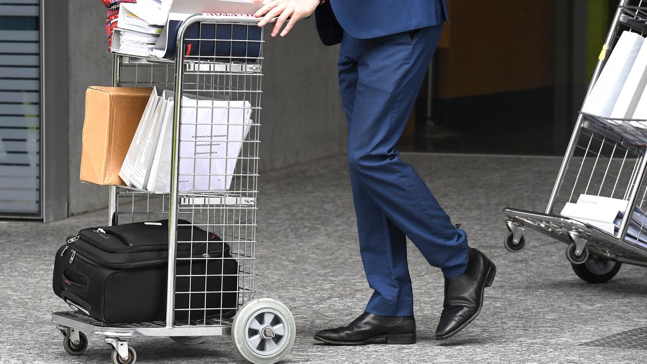 Court documents are wheeled from a court (file image)