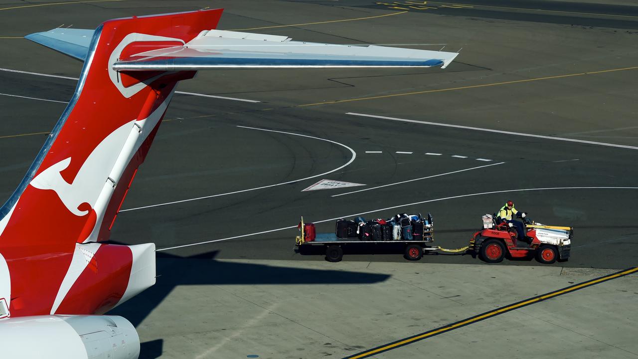 Qantas plane tail and ground crew cart