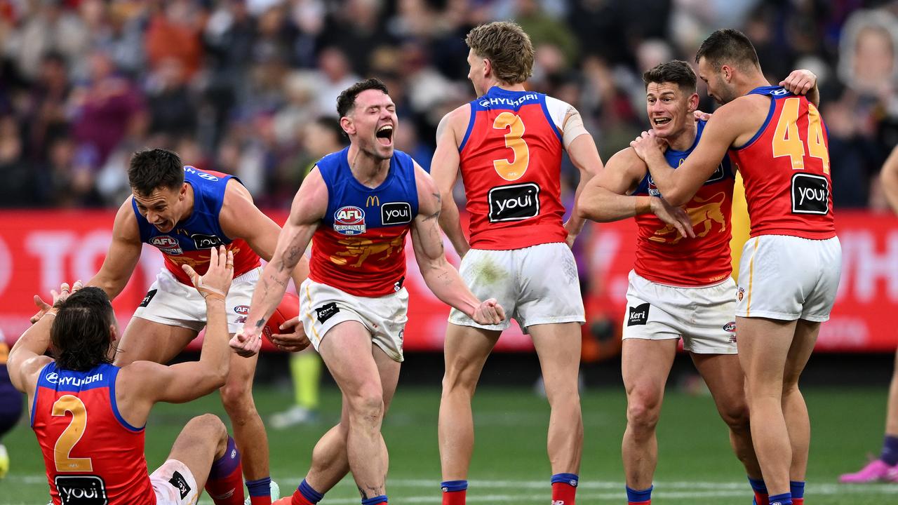 Lachie Neale of the Lions (centre)