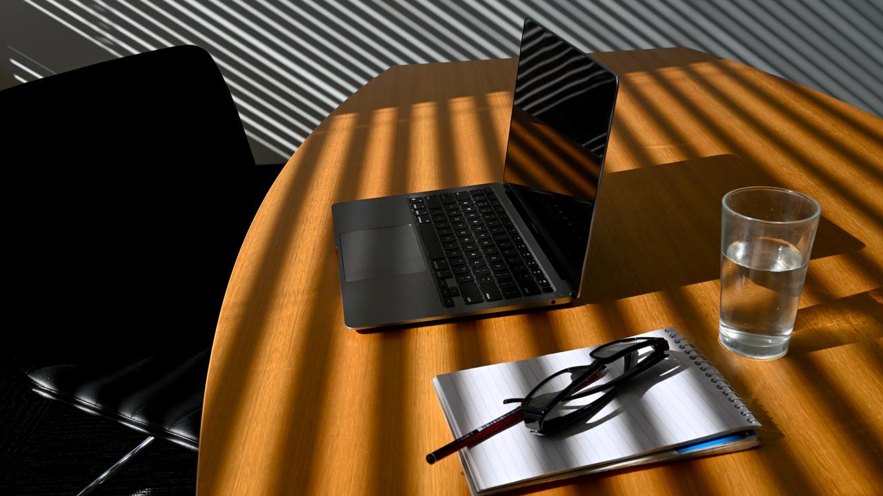 A laptop on a work desk inside an office (file image)