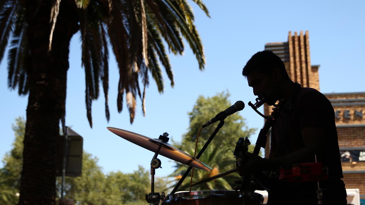A busker in a country street (file image)