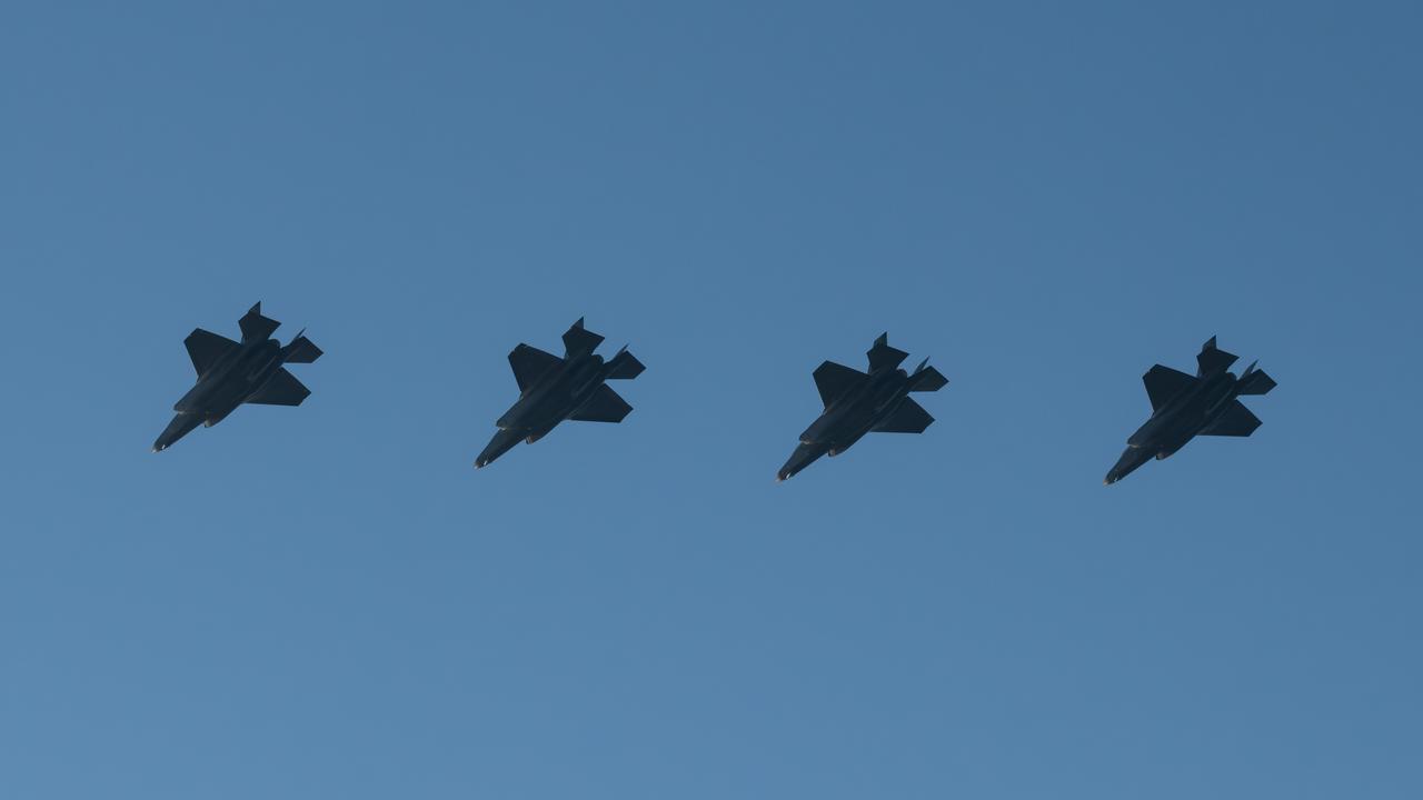 Four F-35A Lightning II aircraft fly in formation