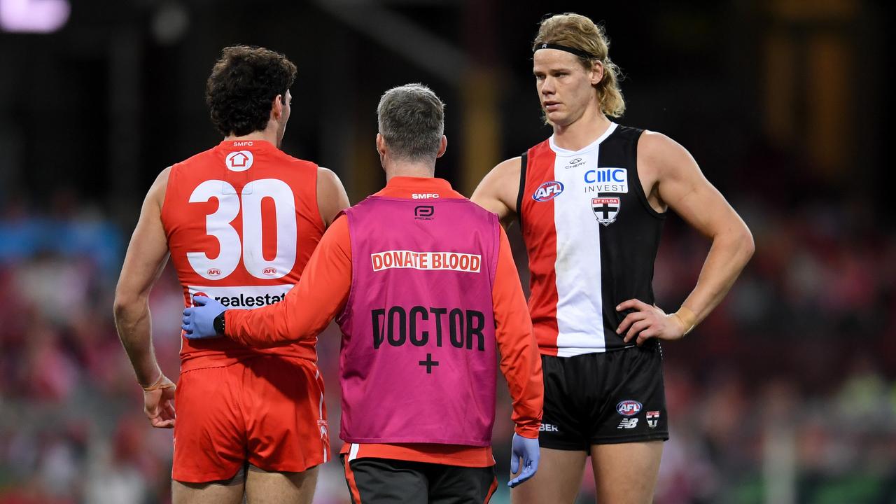 St Kilda's Tom De Koning checks on Tom McCartin