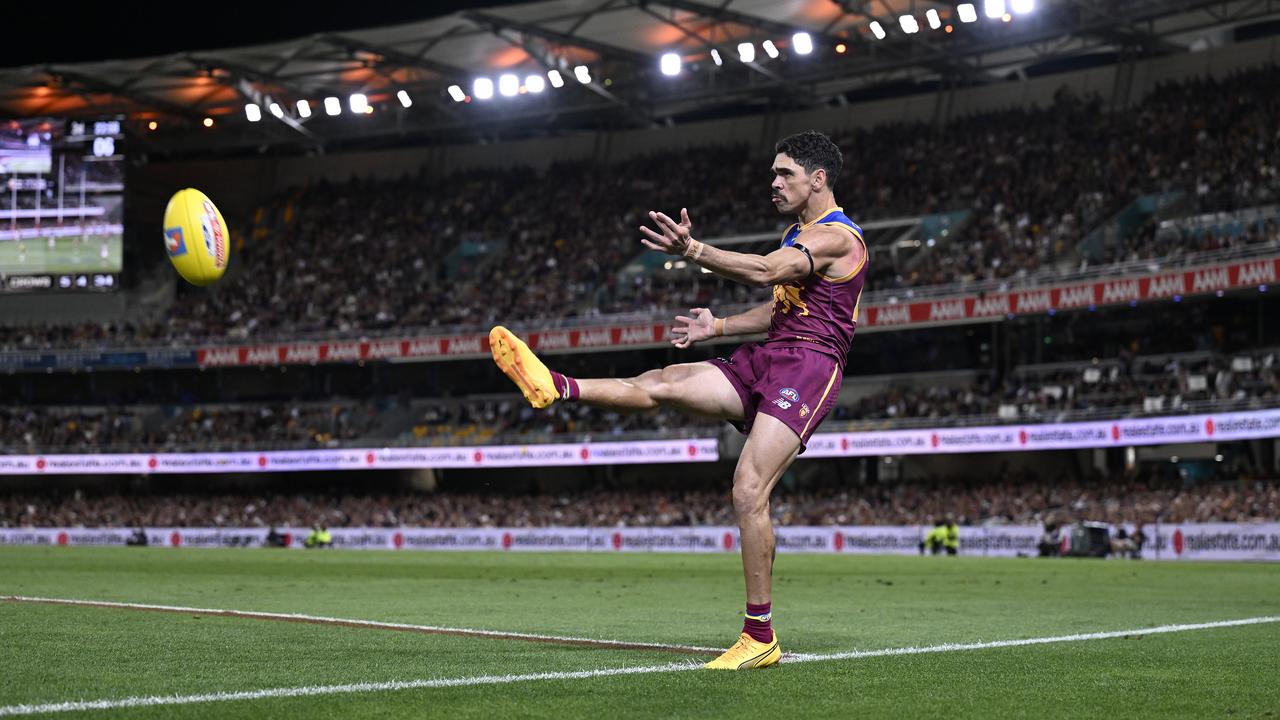 Charlie Cameron of the Lions kicks for goal