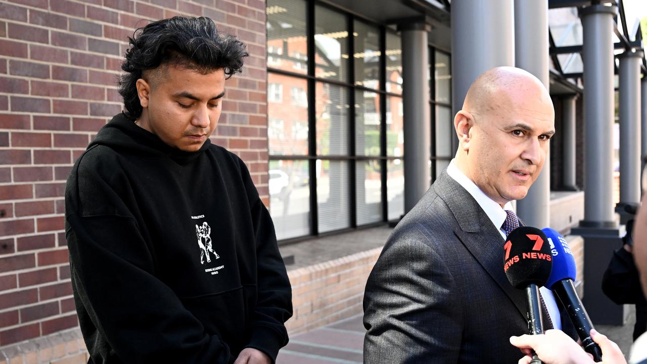 Sandip Adhikari looks on as lawyer Danny Eid speaks