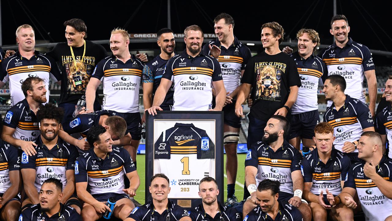 James Slipper poses with his teammates 