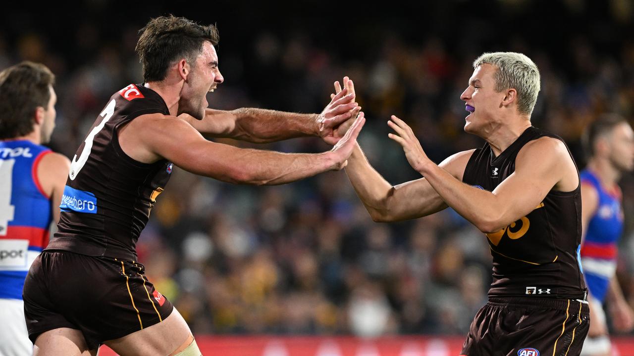 Celebrating Hawks players.