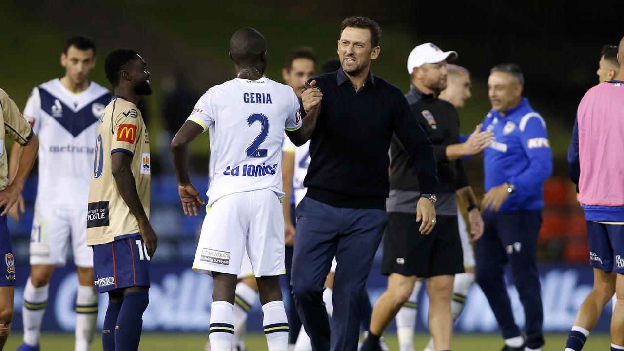 Tony Popovic congratulates Jason Geria.