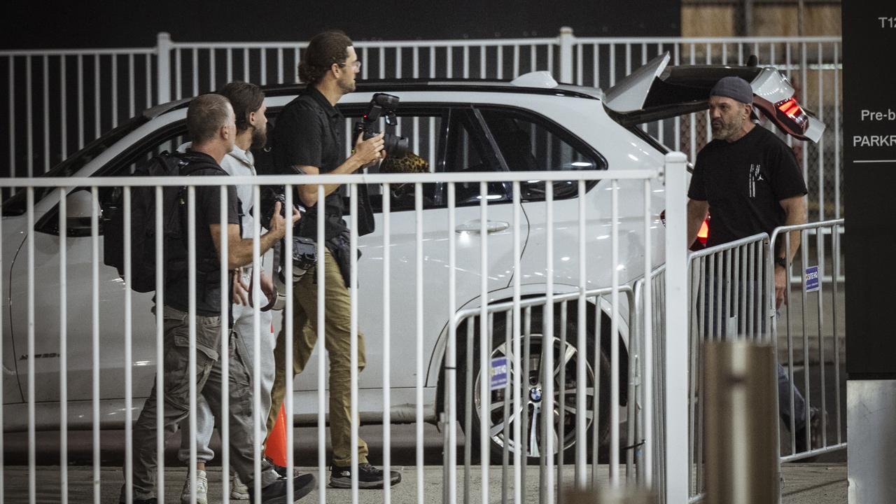 Man approaches photographers