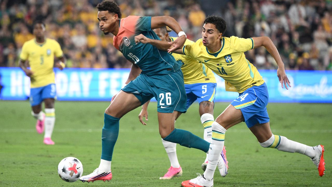 Tete Yengi of the Socceroos makes a run