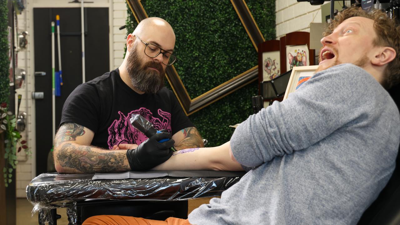 Tattoo artist Tom Green wth artist Dan Withey