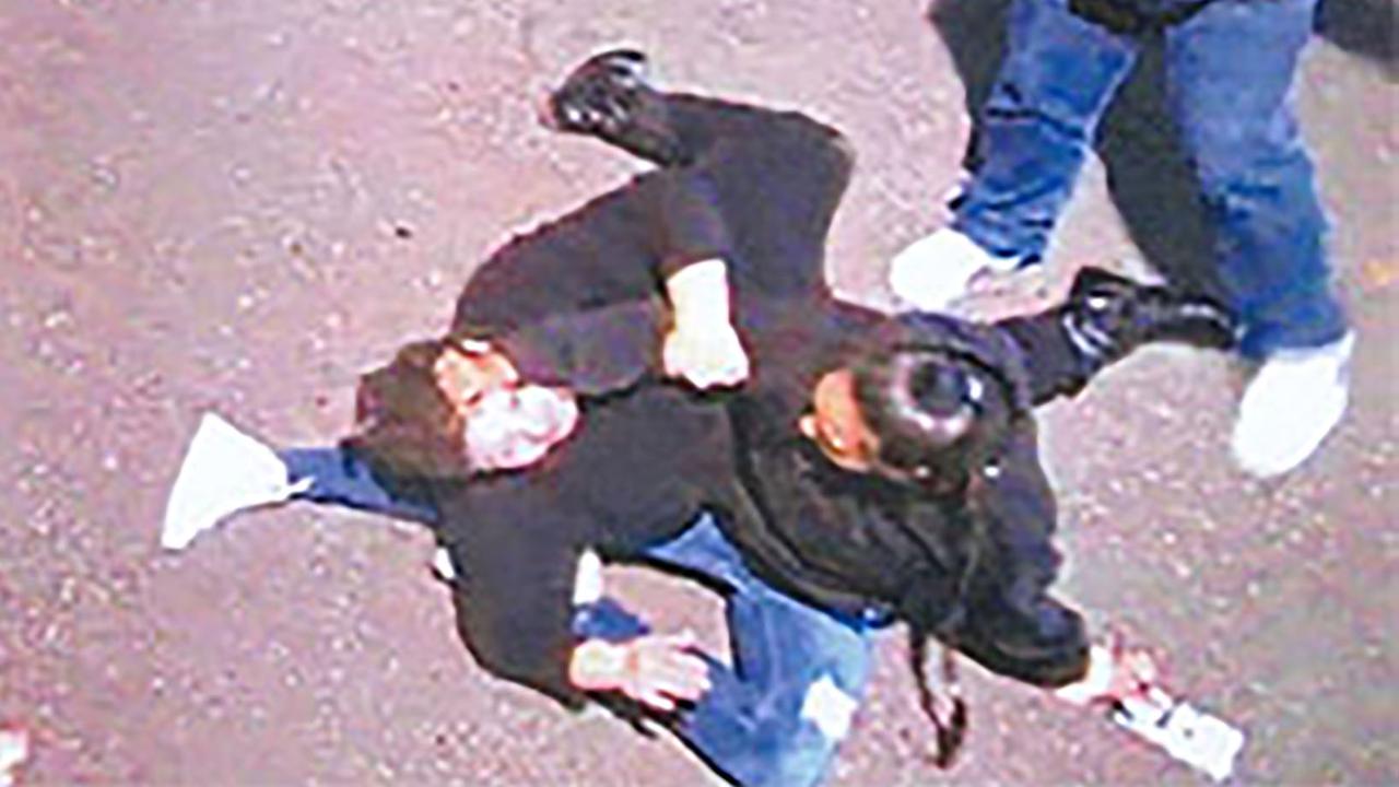 Ebony Bell (right) pulling a person's hair