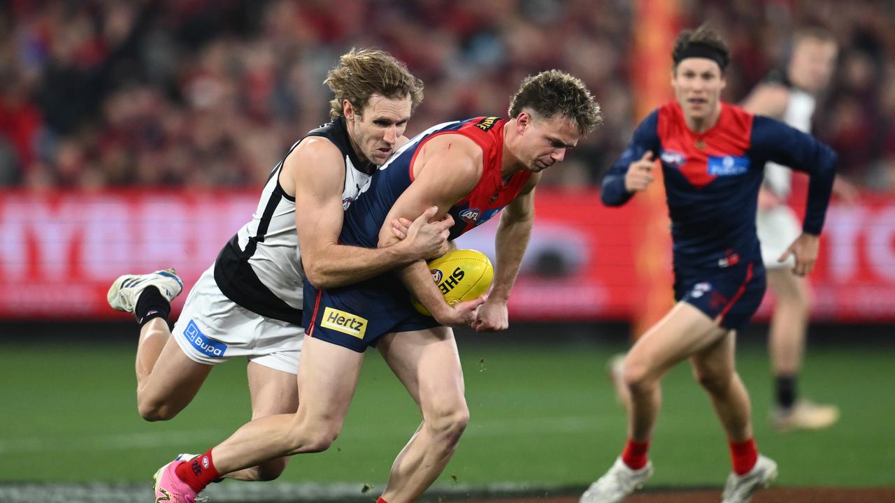 Nick Haynes put the clamps on Melbourne's Harry Sharp.
