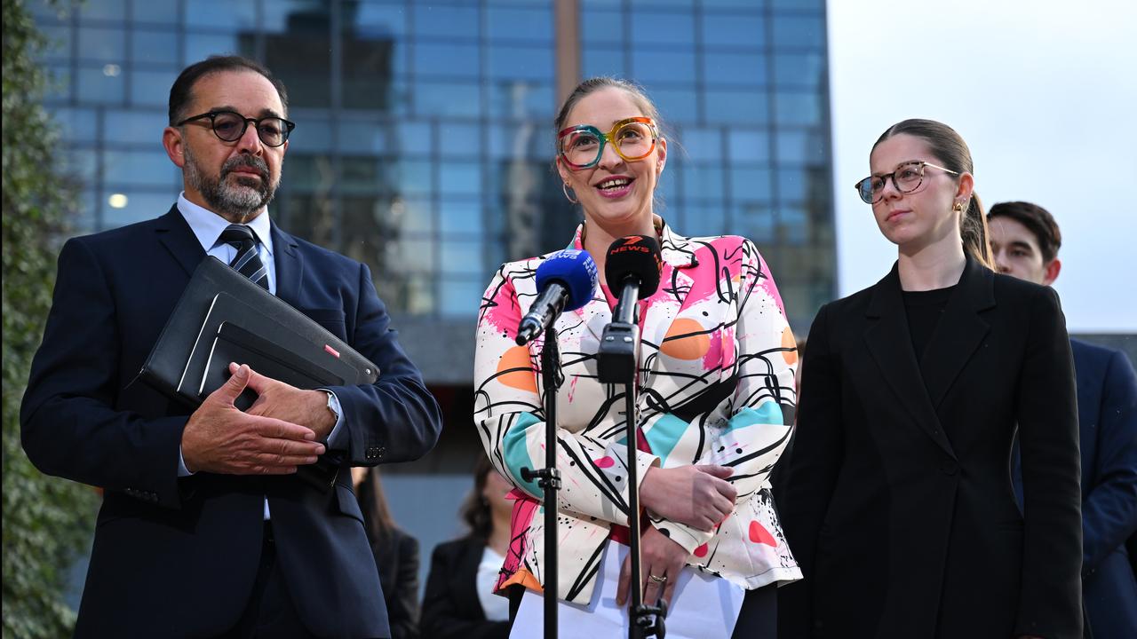 Felicity Button (centre) with lawyers
