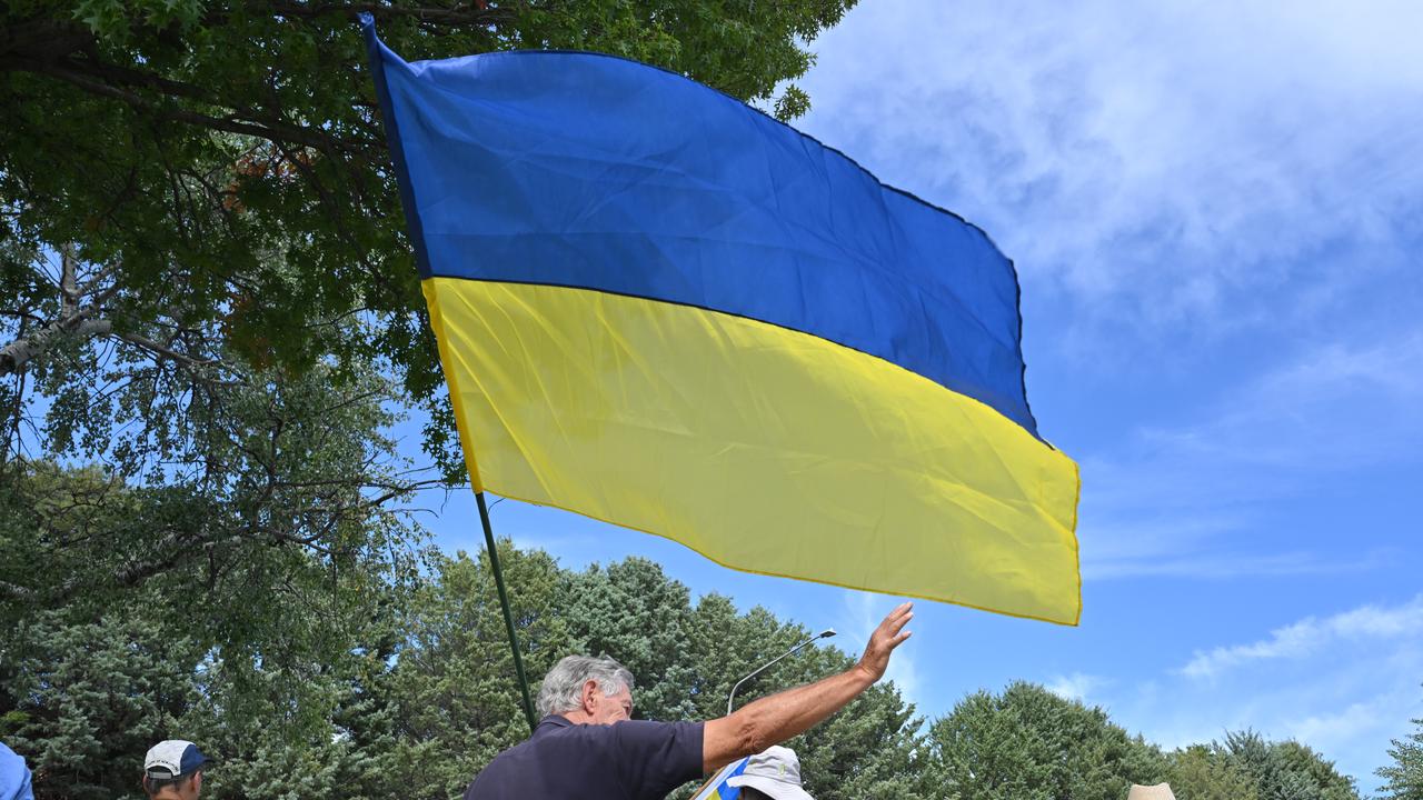 Pro-Ukraine protesters outside Russia's embassy in Canberra in 2025