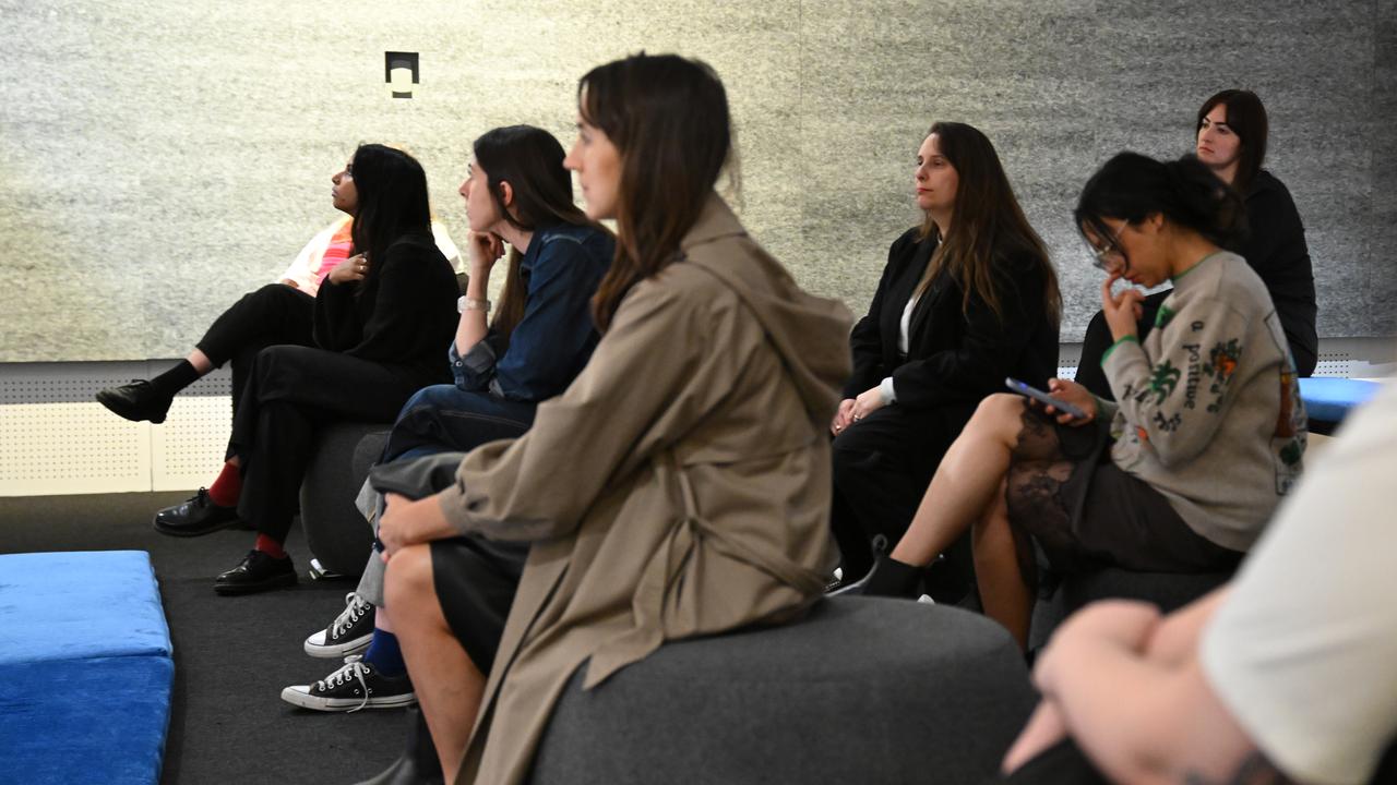 People sitting in the listening room as part of the Reverb exhibition