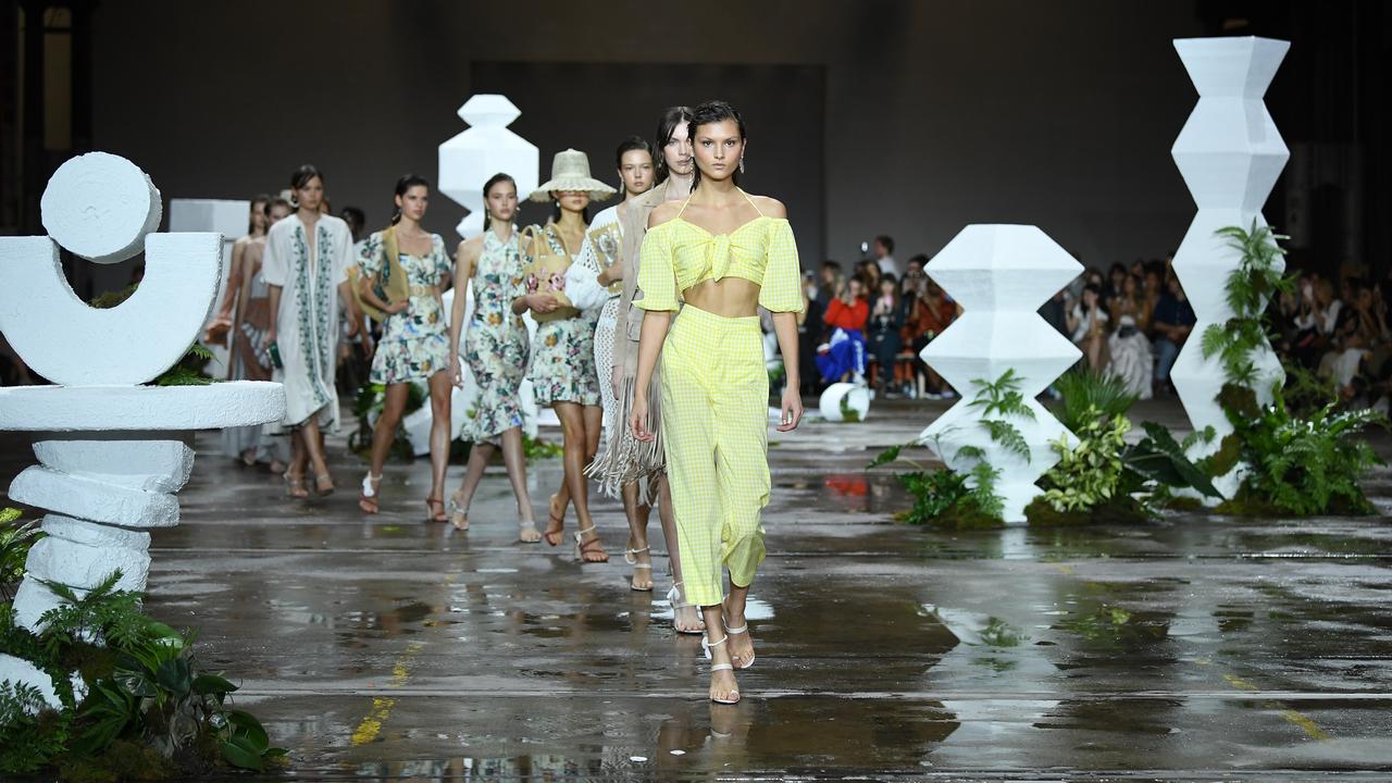 A model walks the runway wearing creations by Tigerlily