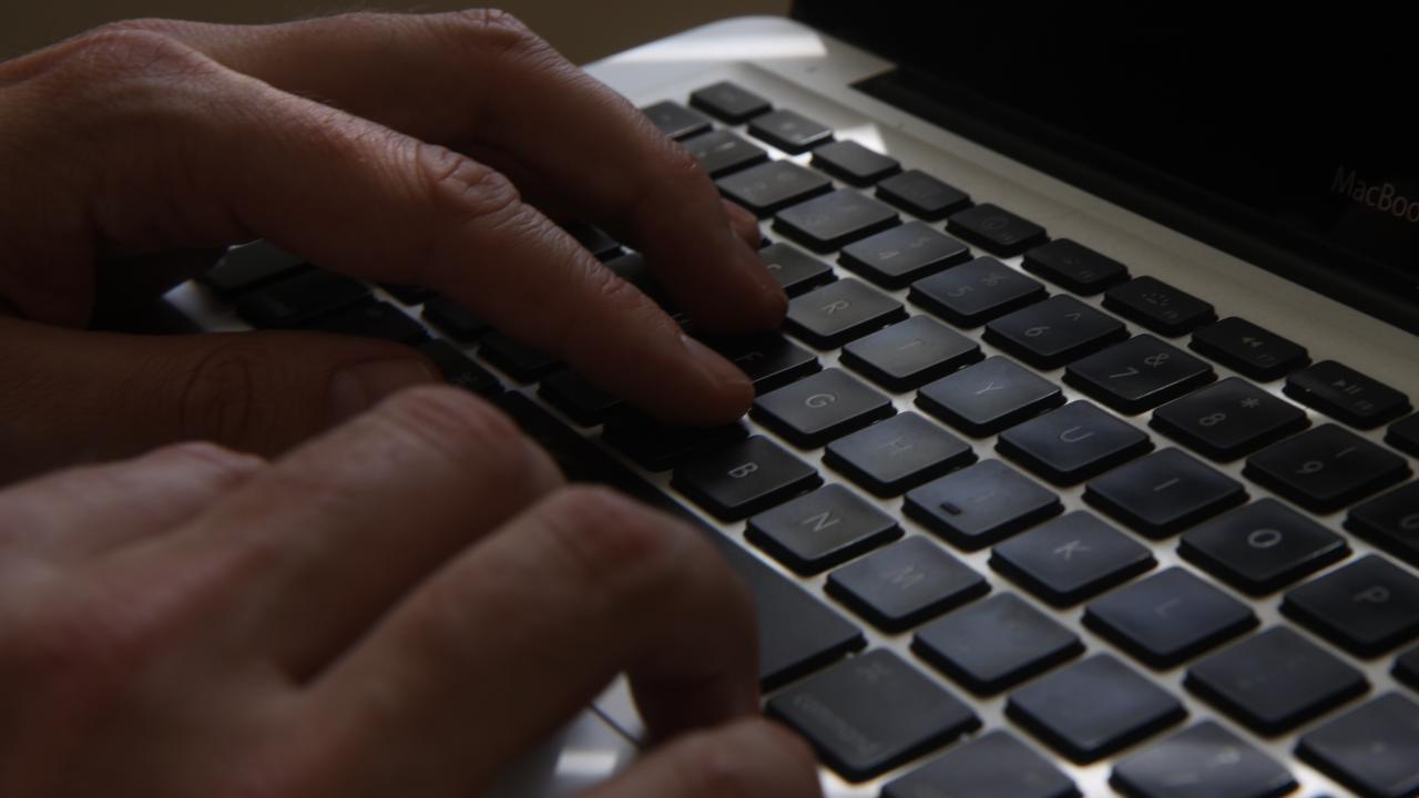 A man using a laptop, Sydney