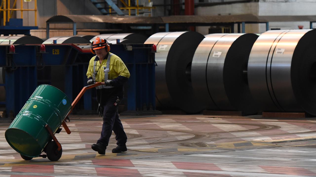 A steel worker with metal coils (file image)
