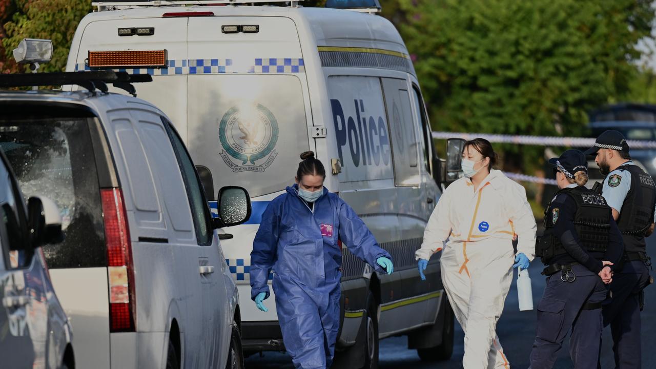 Police at a triple domestic violence murder crime scene