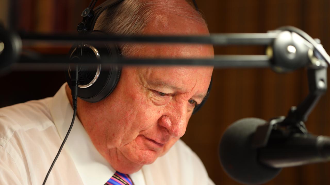 Alan Jones behind mic