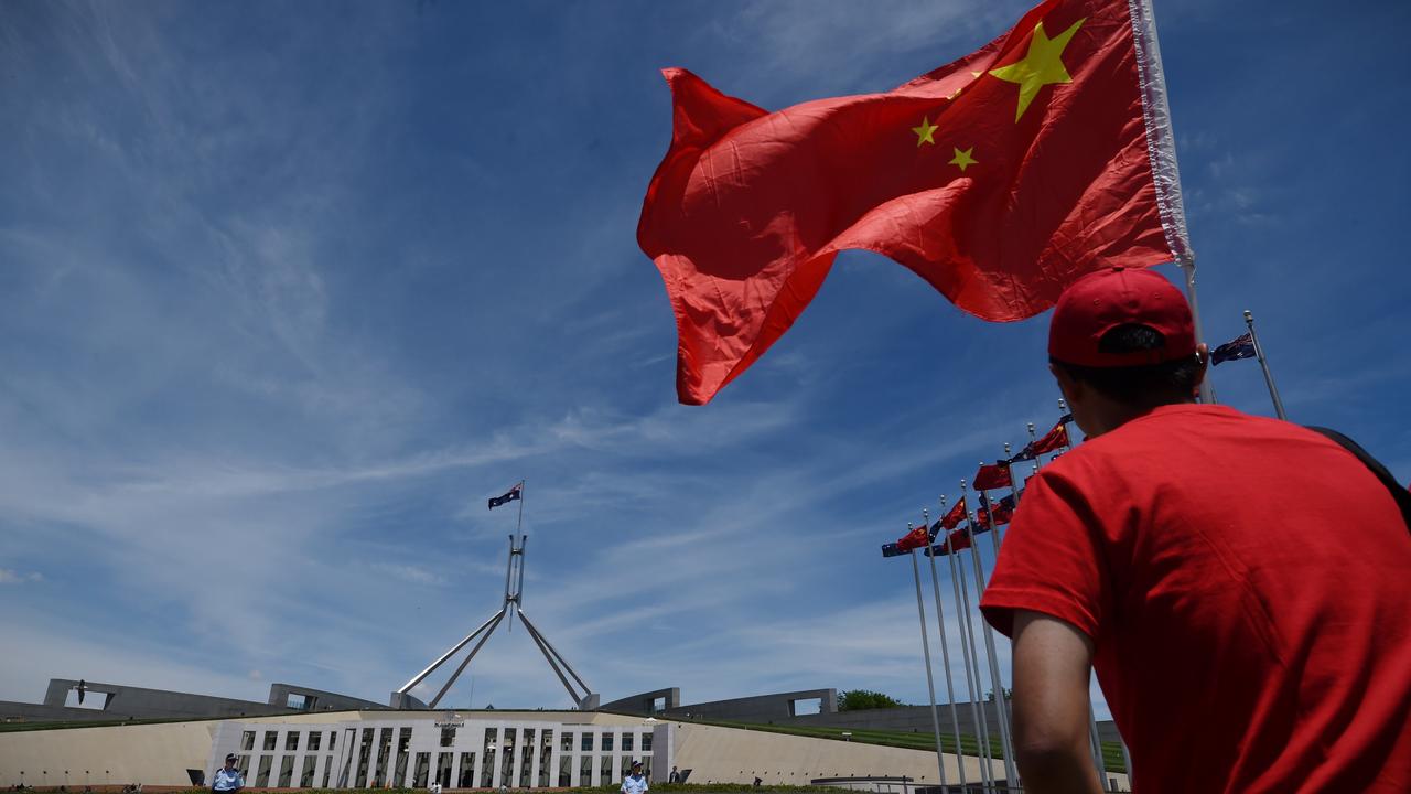 A Chinese government supporter waves a Chinese flag