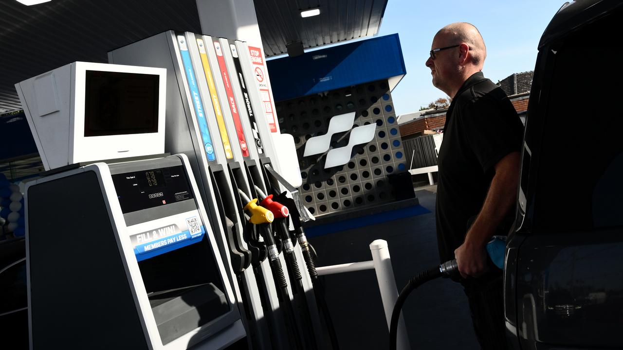 Driver filling up car with petrol