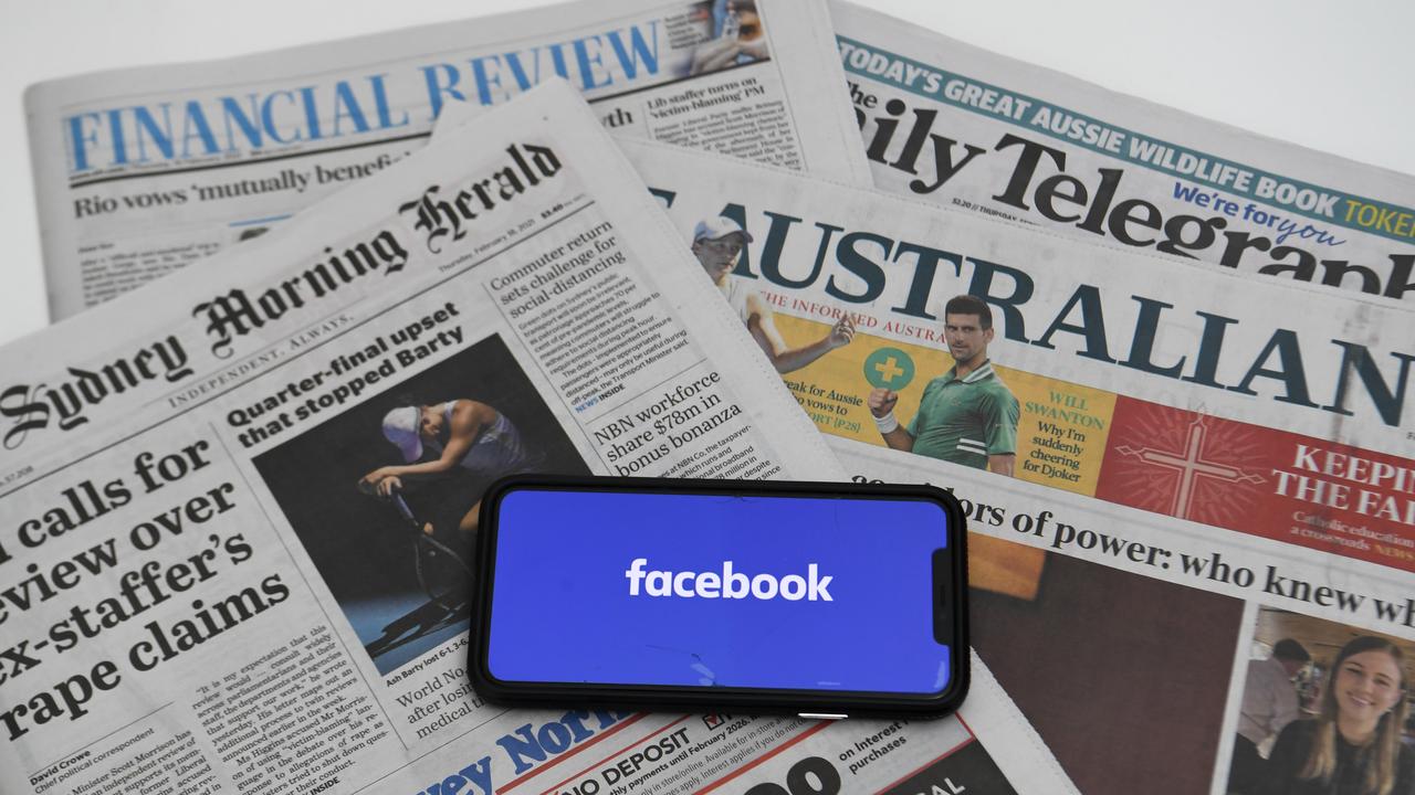Facebook on a phone and Australian newspapers (file image)