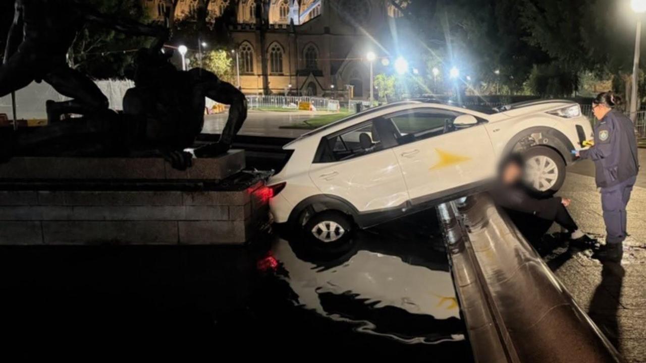 car in park fountain