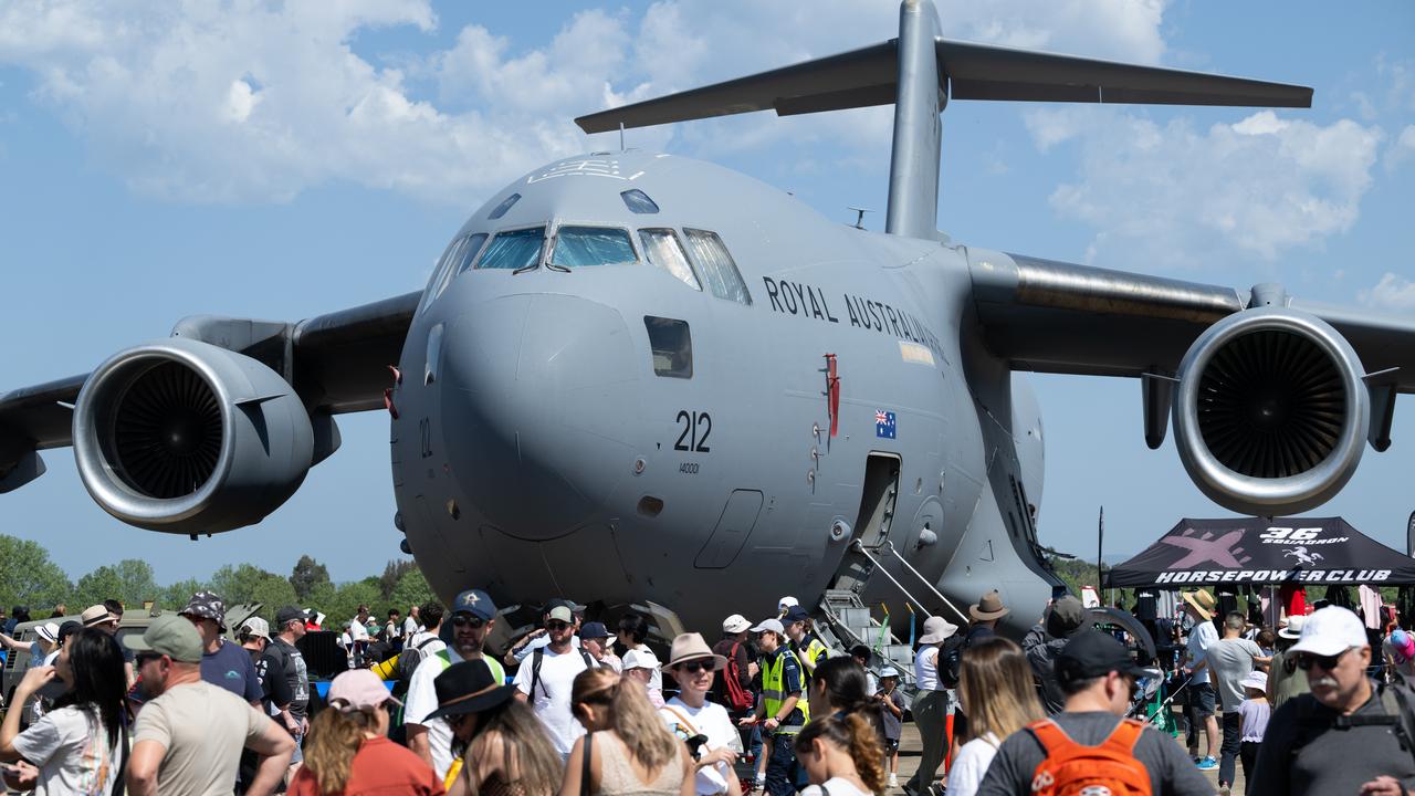 People around a a RAAF C-17A Globemaster aircraft (file image)