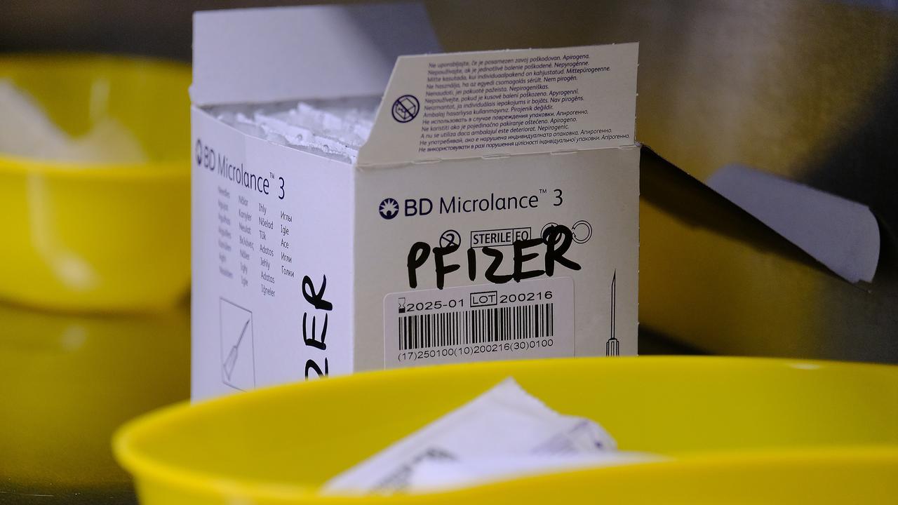 Medical staff at Midtown Medical Clinic prepare the Pfizer vaccine.