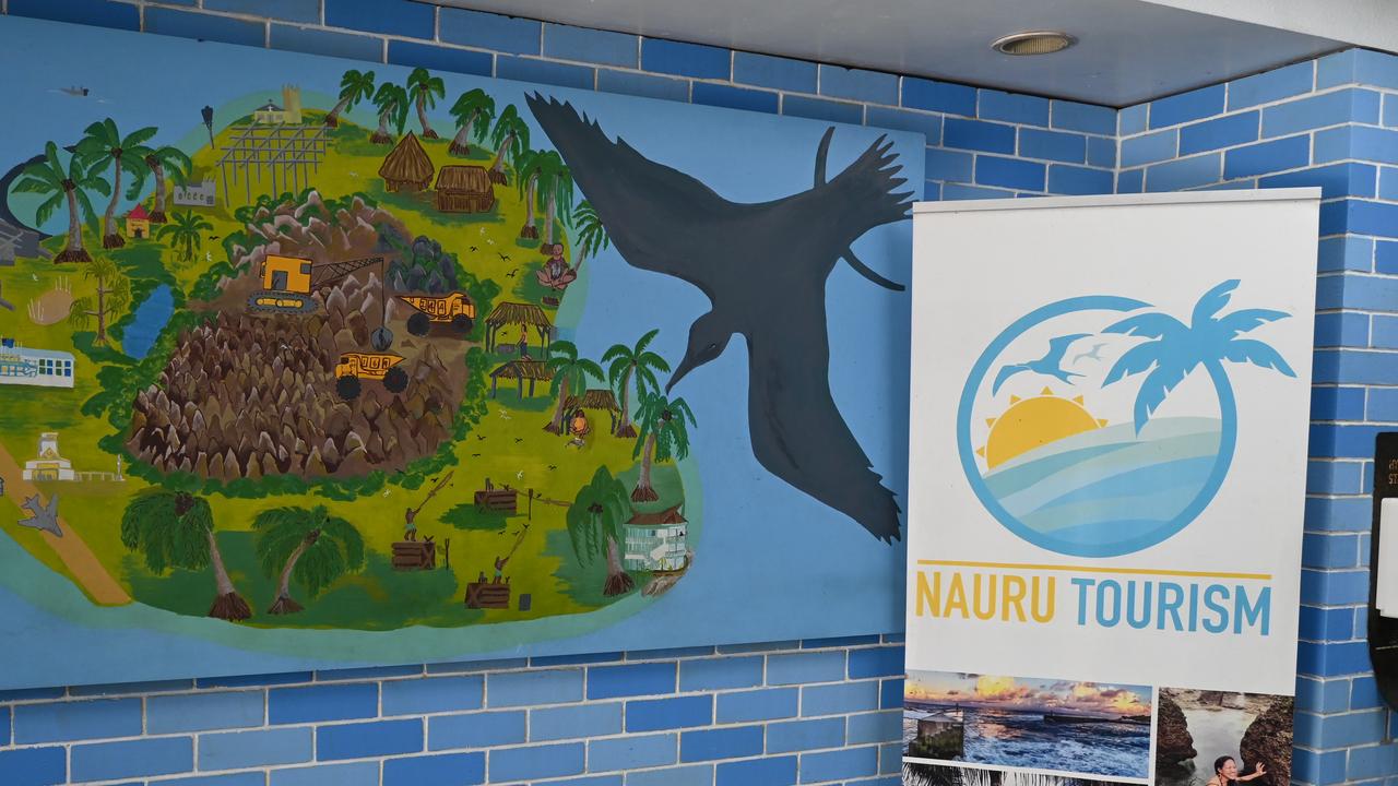 Art and tourism advertisements at the Nauru International Airport