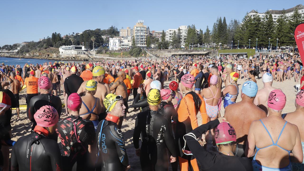 People gather at Coogee beach in Sydney for a community swim