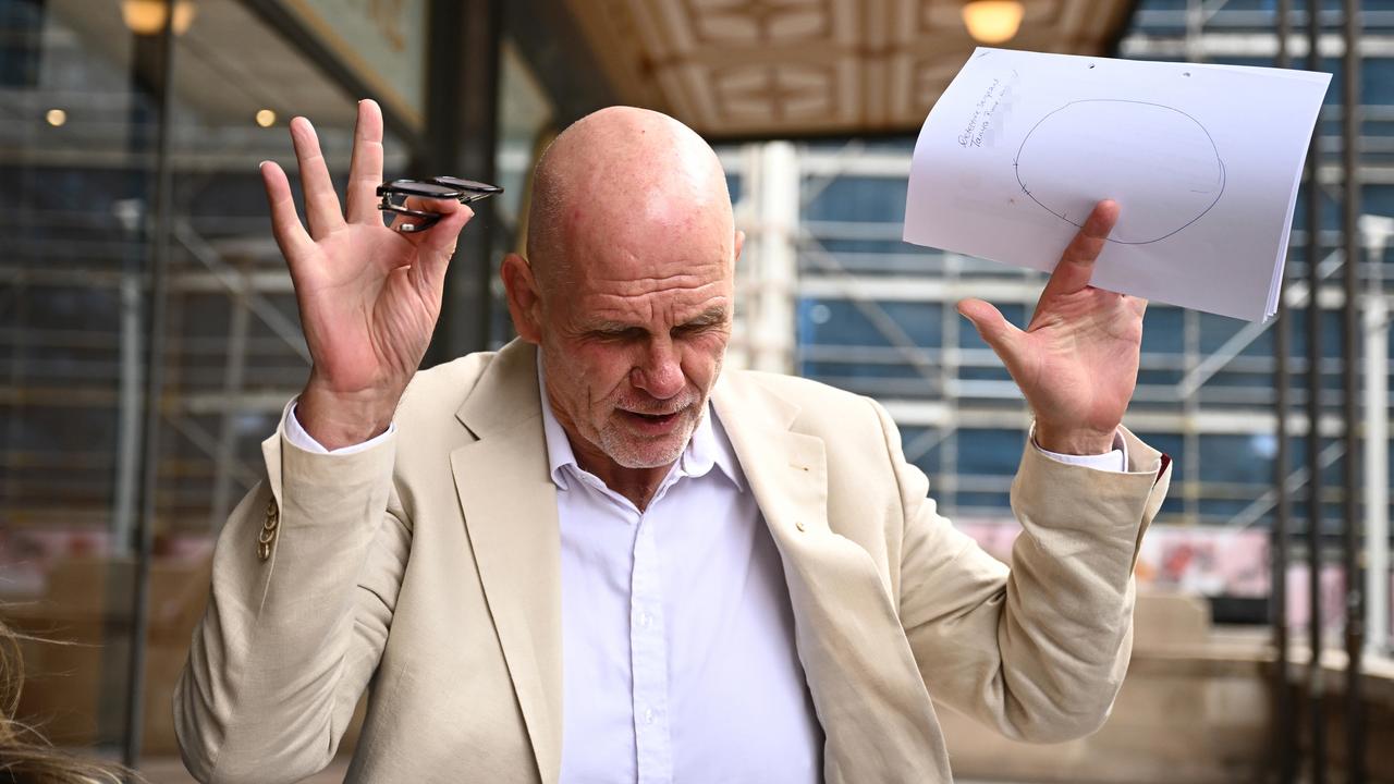Fitzsimons throwing arms in air