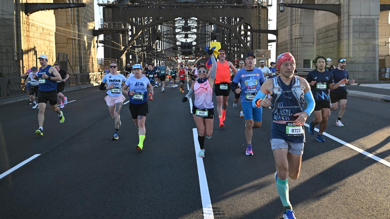 Competitors make their way over the Sydney Harbour Bridge in 2025.