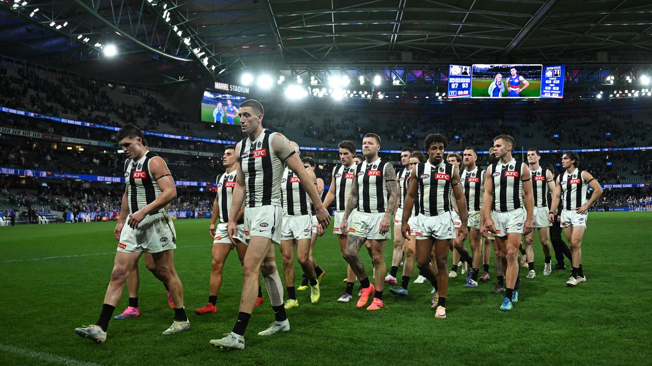 Collingwood exit the field after their AFL  loss to the Bulldogs