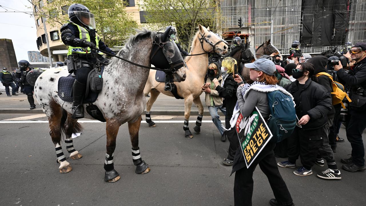 Protesters clash with mounted Victoria Police