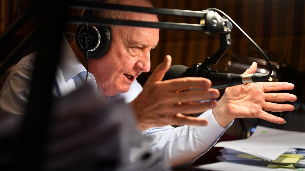 Jones behind mic