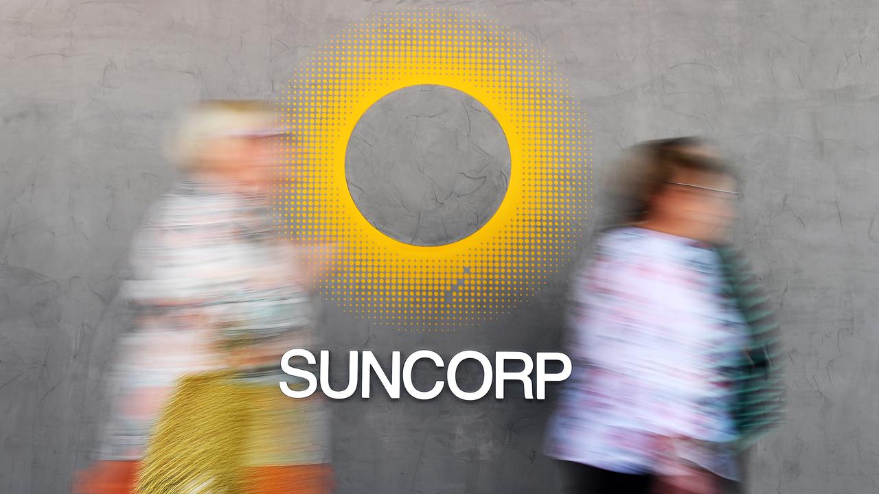 People walk past a Suncorp sign (file image)