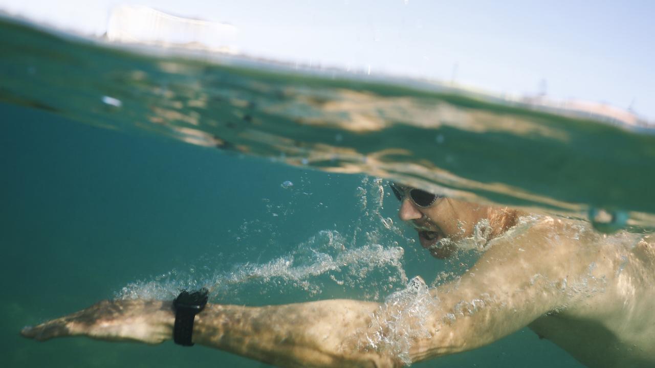 A swimmer participates in a community swim