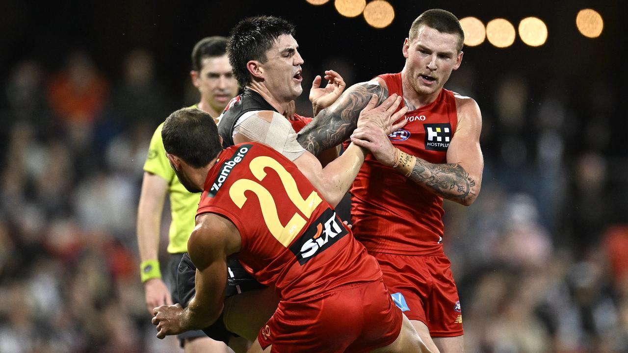 Ben Long and Bailey Humphrey team up against Magpie Brayden Maynard.