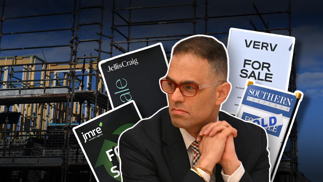 NSW Treasurer Daniel Mookhey with for sale signs (file image)
